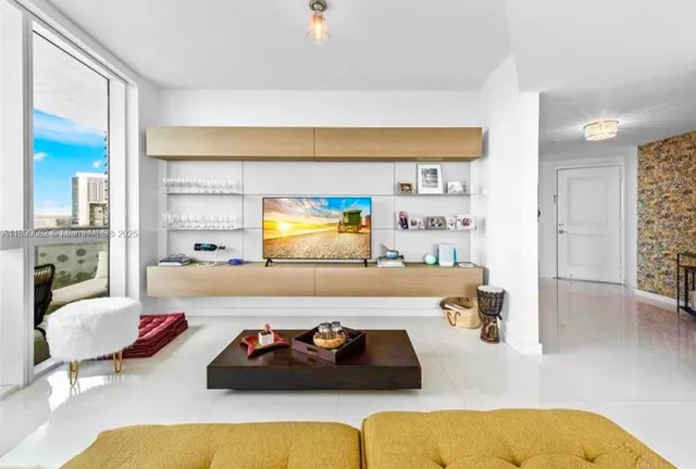 a living room with furniture and a table