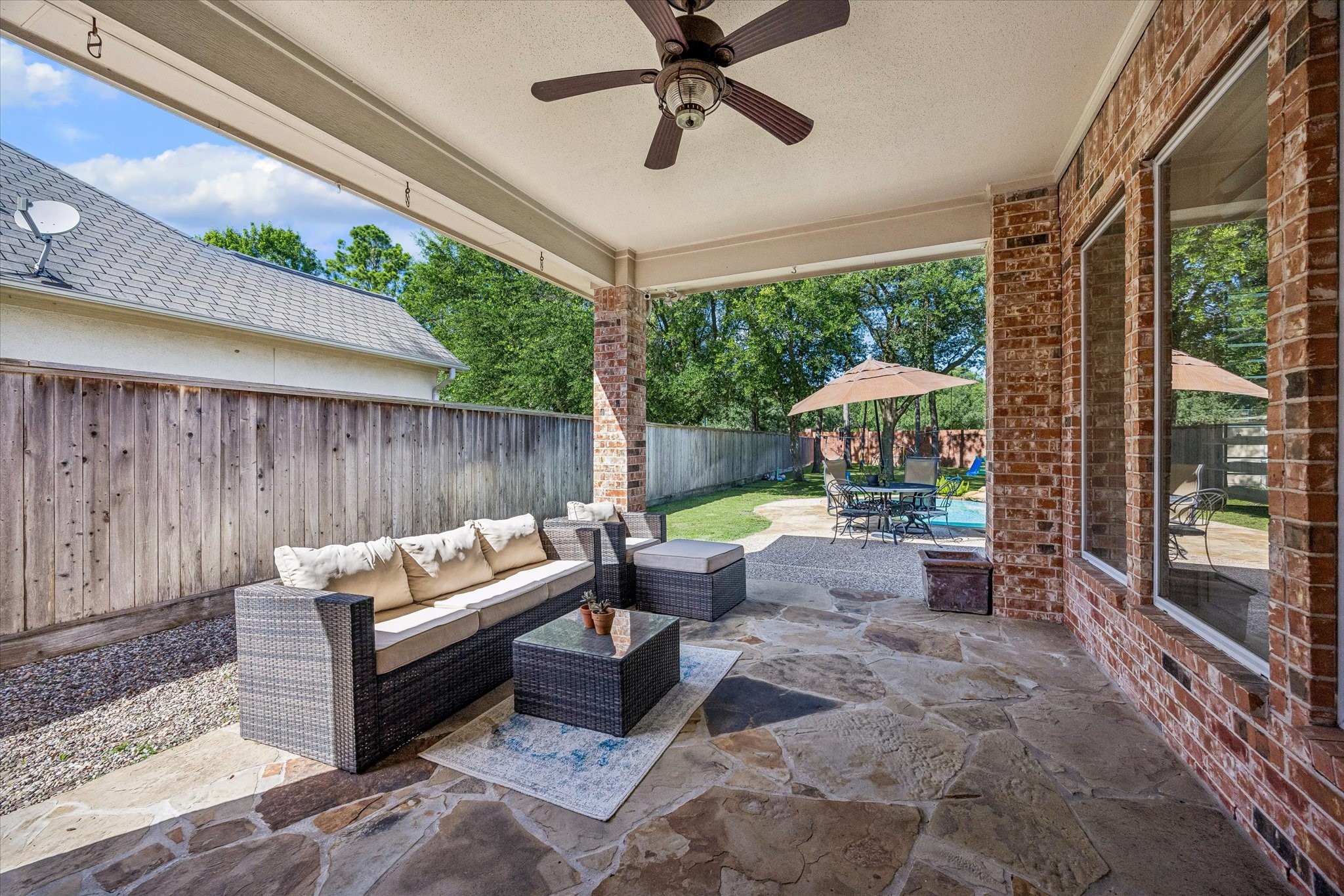 3047 Bonnebridge Way Boulevard Houston, TX 77082 - Photo 19 of 50 Covered veranda providing a spacious lounge area perfect for relaxing while enjoying beautiful views of the pool.