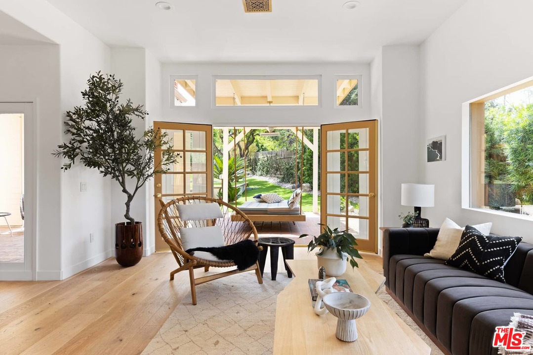 1435 Crest Drive Altadena, CA 91001 - Photo 11 of 54 a living room with furniture and a large window