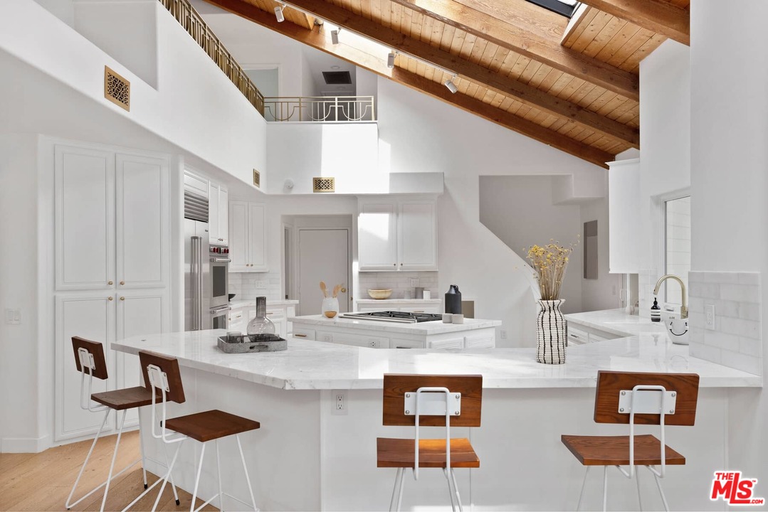 1435 Crest Drive Altadena, CA 91001 - Photo 12 of 54 a kitchen with stainless steel appliances kitchen island granite countertop a sink and cabinets