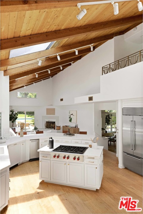 1435 Crest Drive Altadena, CA 91001 - Photo 16 of 54 a large white kitchen with a stove a sink and a refrigerator