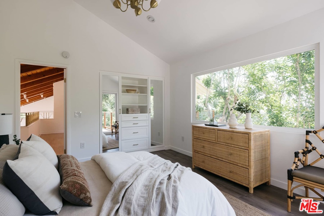 1435 Crest Drive Altadena, CA 91001 - Photo 23 of 54 a bedroom with a bed and large window