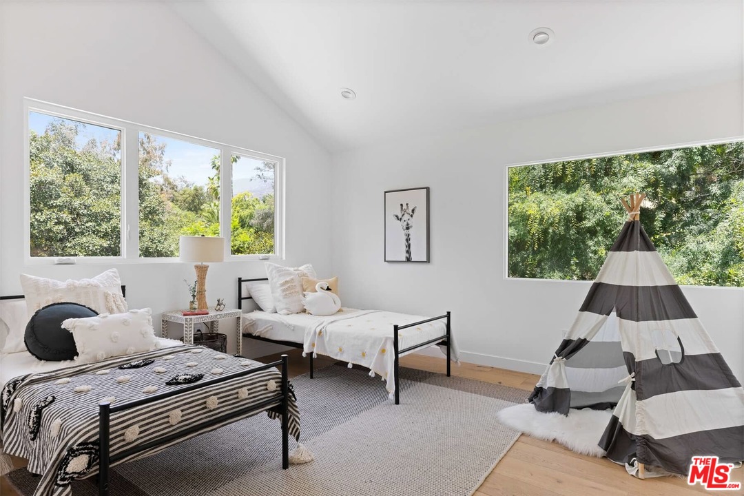 1435 Crest Drive Altadena, CA 91001 - Photo 27 of 54 a bedroom with a bed and a window