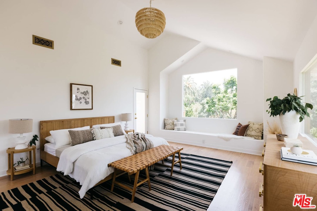 1435 Crest Drive Altadena, CA 91001 - Photo 31 of 54 a bedroom with a bed and a window