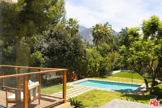a bathroom with a bathtub a sink and a window