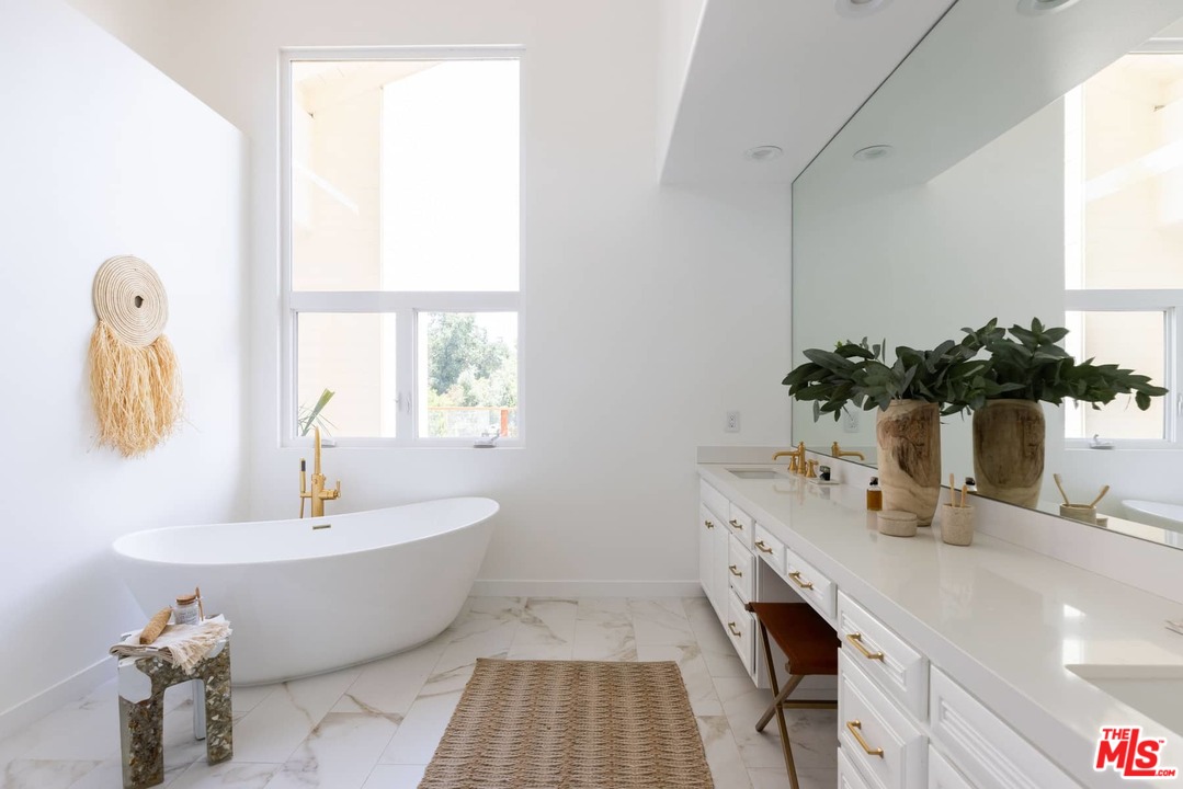 1435 Crest Drive Altadena, CA 91001 - Photo 41 of 54 a bathroom with a bathtub a sink and a window
