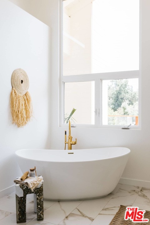 1435 Crest Drive Altadena, CA 91001 - Photo 45 of 54 a bathroom with a bathtub and a window
