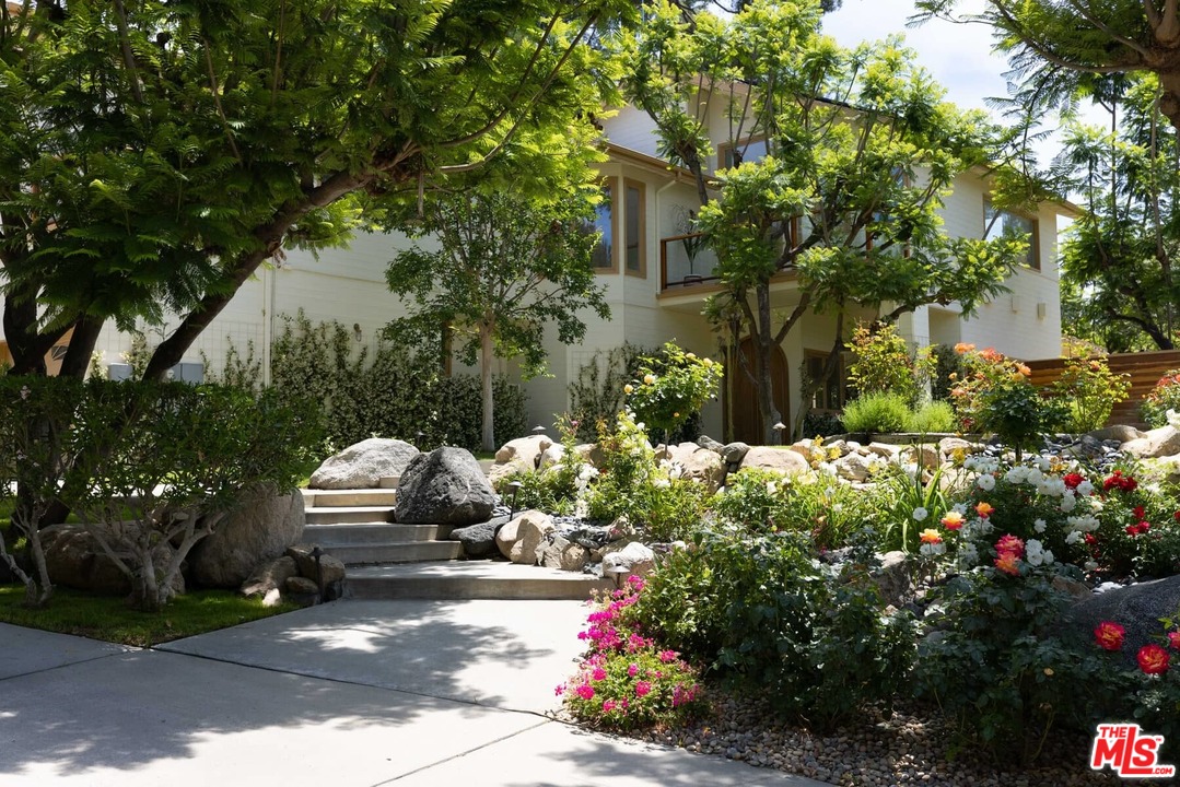 1435 Crest Drive Altadena, CA 91001 - Photo 53 of 54 a backyard of a house with lots of green space and trees