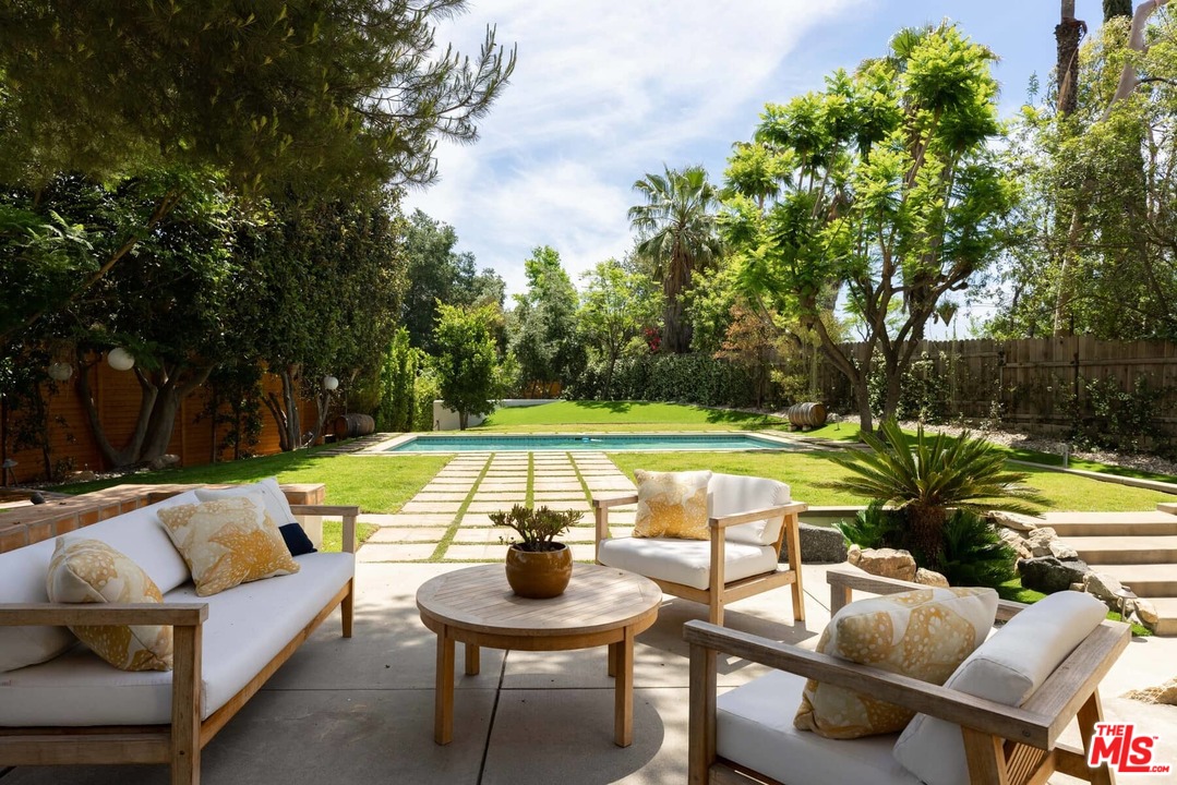 1435 Crest Drive Altadena, CA 91001 - Photo 8 of 54 a view of swimming pool with chairs and a fire pit