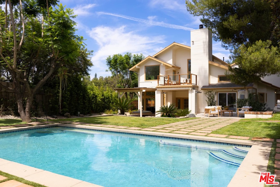 1435 Crest Drive Altadena, CA 91001 - Photo 10 of 54 a view of an house with swimming pool and trees in the background