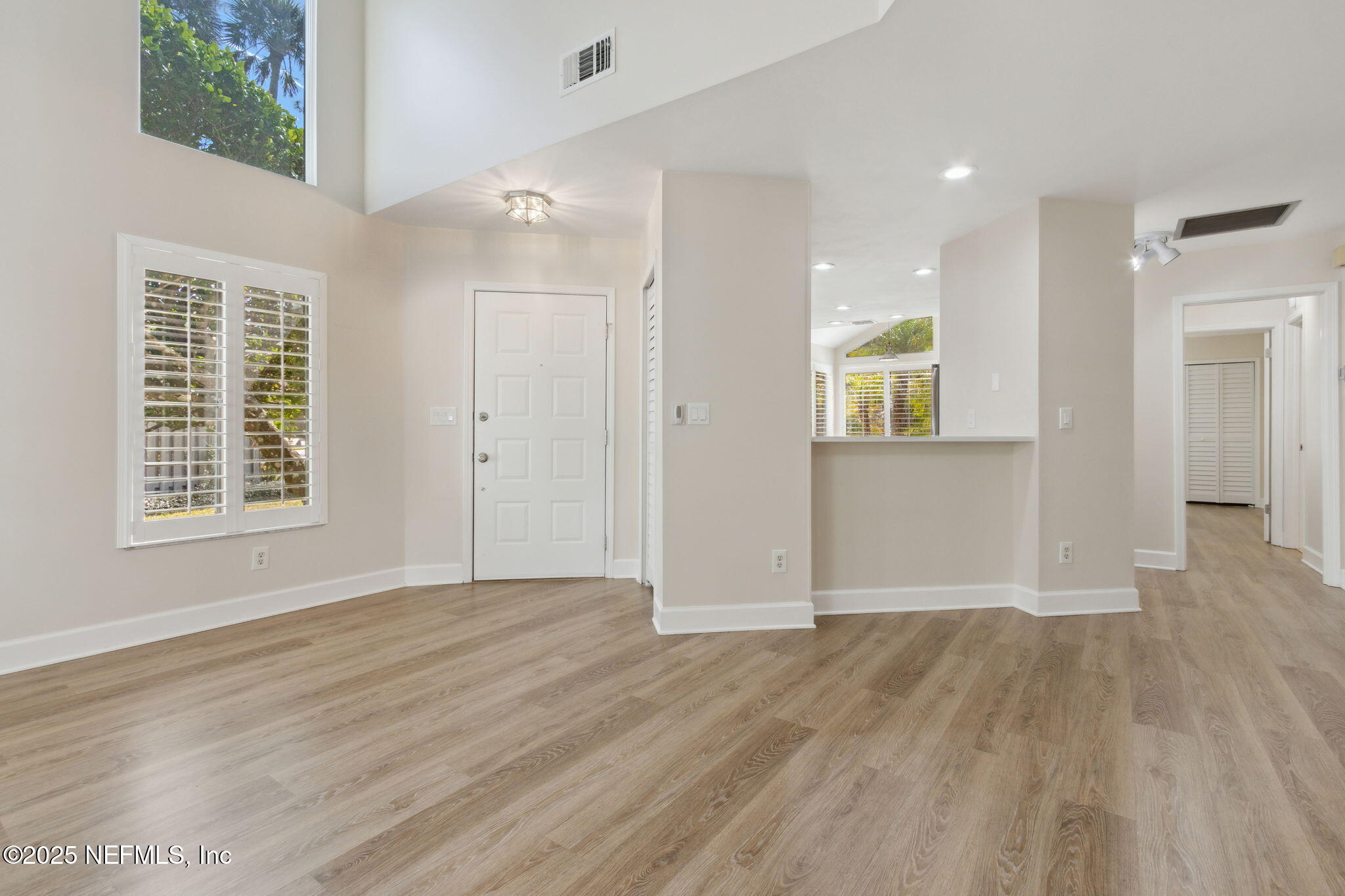 14 Turtleback Trail Ponte Vedra Beach, FL 32082 - Photo 8 of 63 an empty room with wooden floor and windows