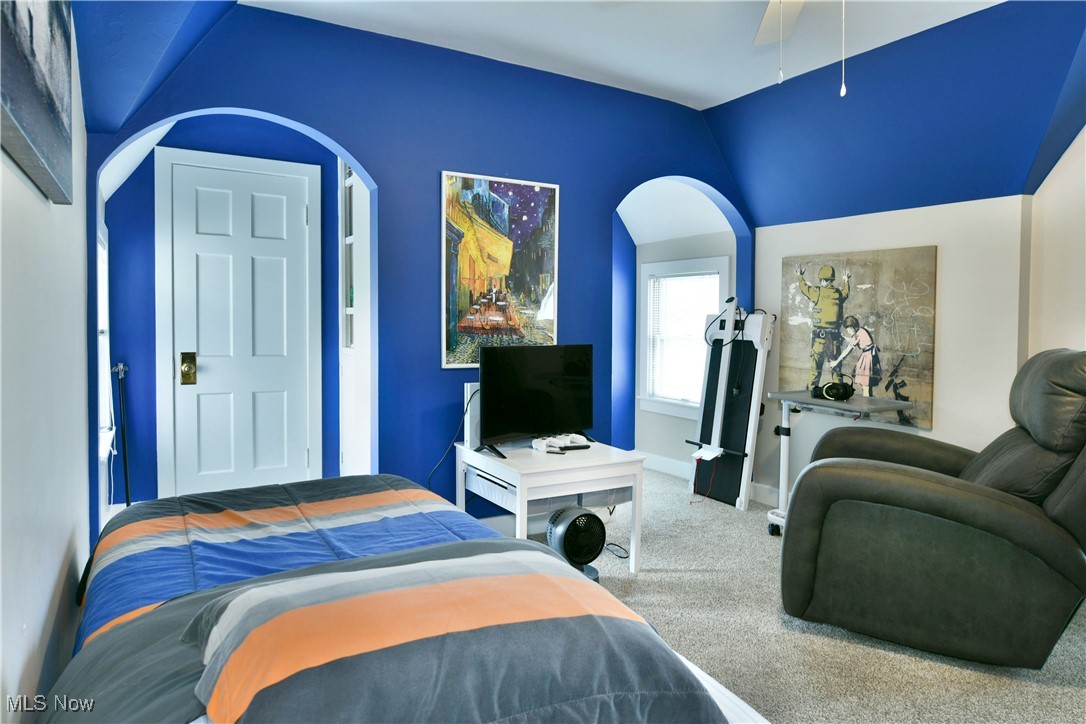 519 Butler Road Northeast Warren, OH 44483 - Photo 45 of 50 Carpeted bedroom featuring vaulted ceiling and ceiling fan