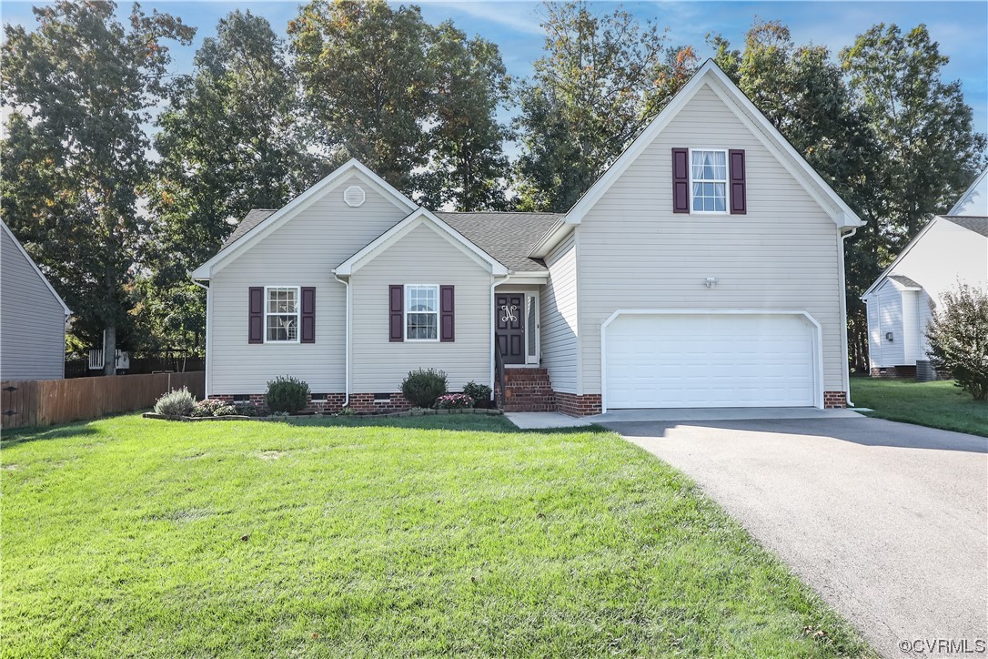 a view of a yard in front of a house with large trees
