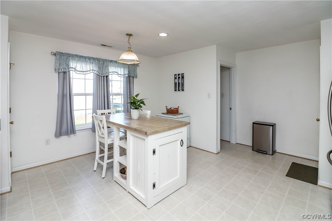 9219 Alcove Grove Road Chesterfield, VA 23832 - Photo 15 of 41 a kitchen with granite countertop white cabinets and refrigerator