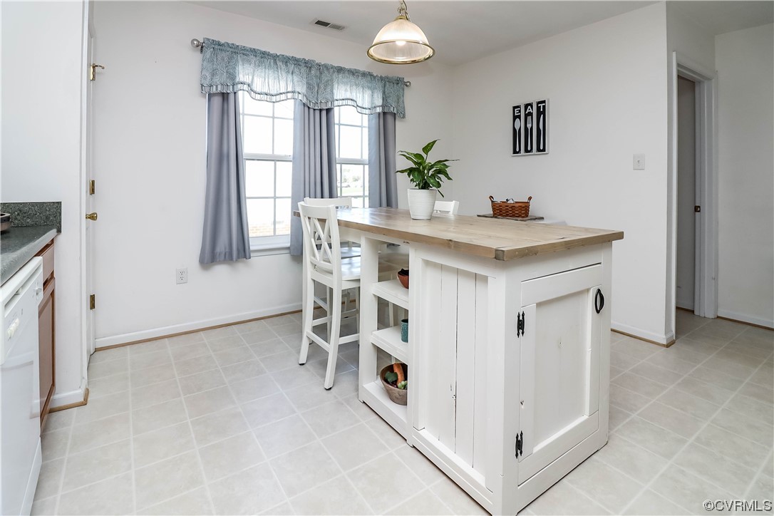 9219 Alcove Grove Road Chesterfield, VA 23832 - Photo 17 of 41 a view of kitchen island with stainless steel appliances granite countertop furniture and window