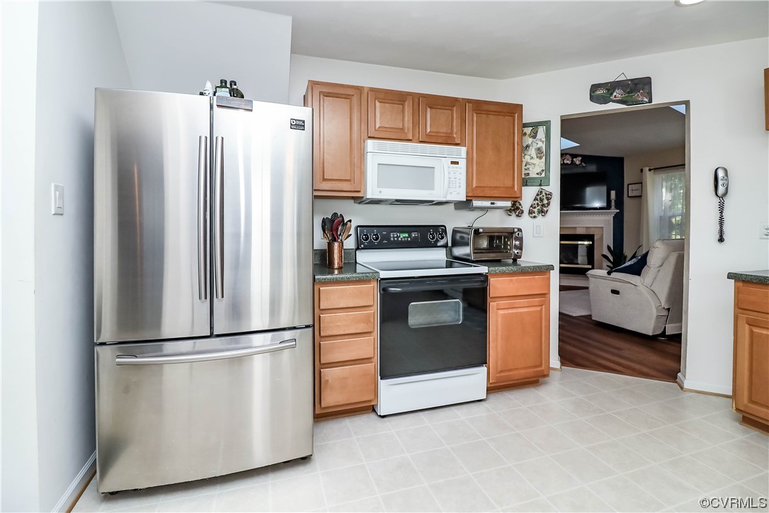 9219 Alcove Grove Road Chesterfield, VA 23832 - Photo 21 of 41 a kitchen with stainless steel appliances a refrigerator sink and cabinets