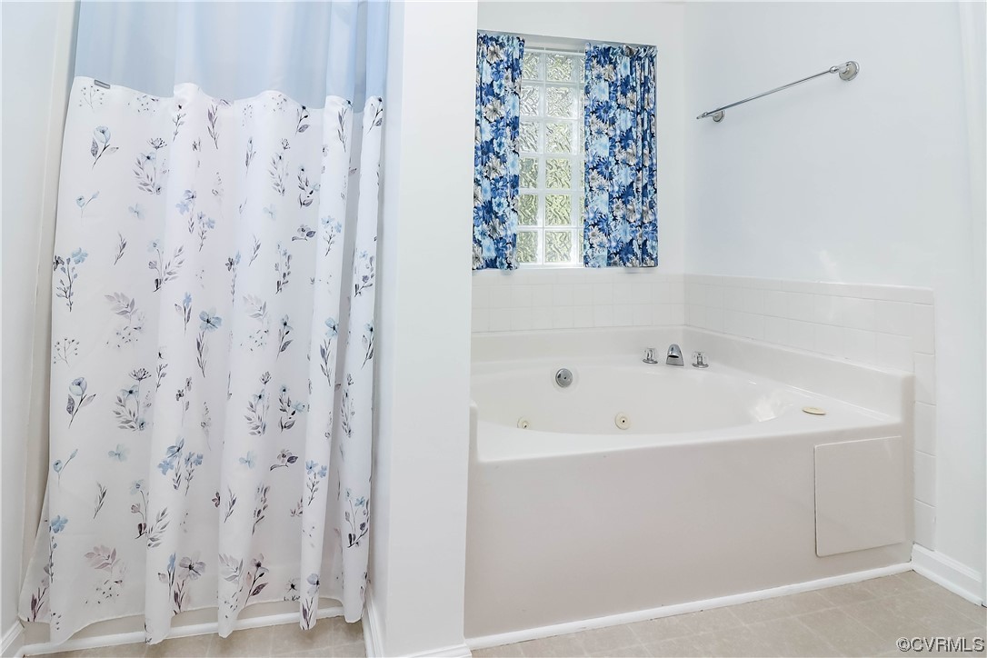 9219 Alcove Grove Road Chesterfield, VA 23832 - Photo 25 of 41 a bathroom with a bathtub and shower