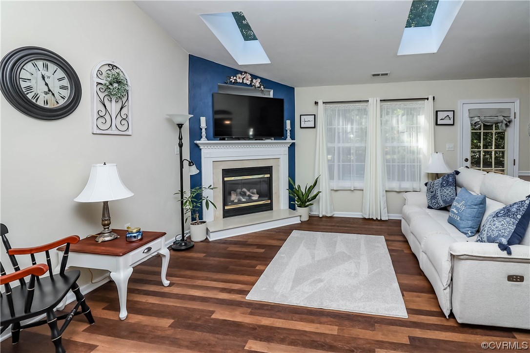 9219 Alcove Grove Road Chesterfield, VA 23832 - Photo 5 of 41 a living room with furniture a fireplace and a flat screen tv