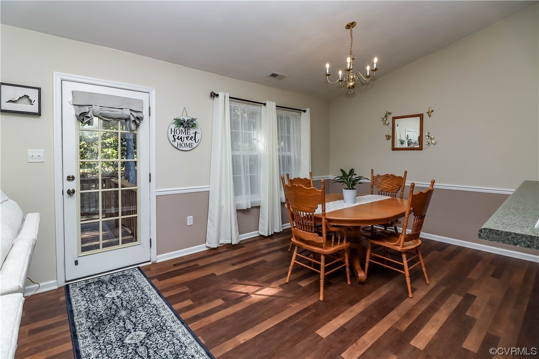 9219 Alcove Grove Road Chesterfield, VA 23832 - Photo 7 of 41 a dining room with wooden floor and window