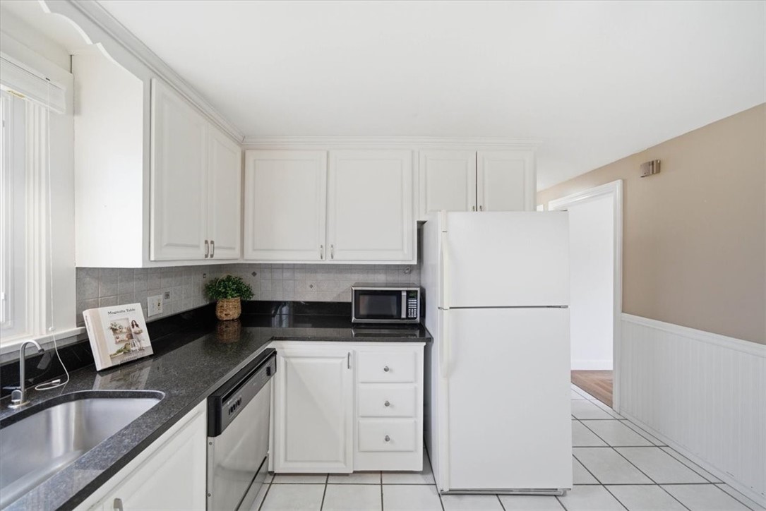 28 Glenbrook Road Warwick, RI 02889 - Photo 13 of 43 Another kitchen view looking back towards the living room/hallway.