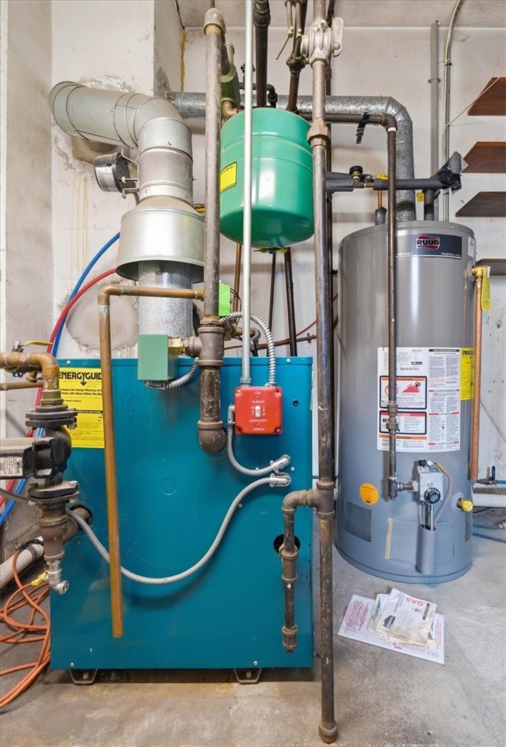 28 Glenbrook Road Warwick, RI 02889 - Photo 30 of 43 Enjoy efficient natural gas baseboard heat, public water, and public sewer, along with updated mechanicals including a Burnham gas boiler and newer hot water tank.