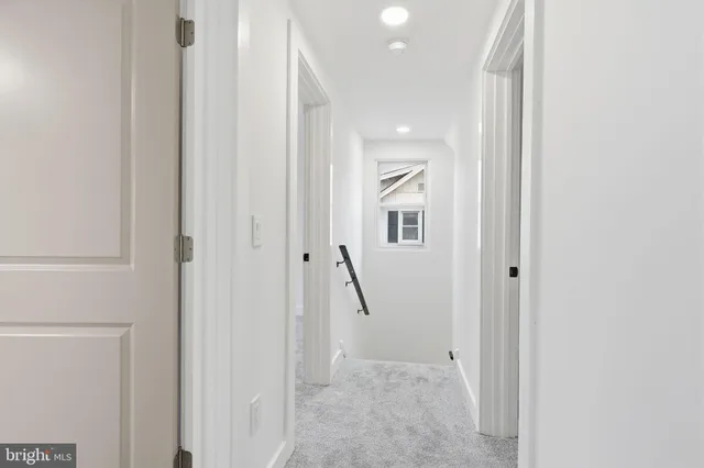 a view of an entryway with hallway