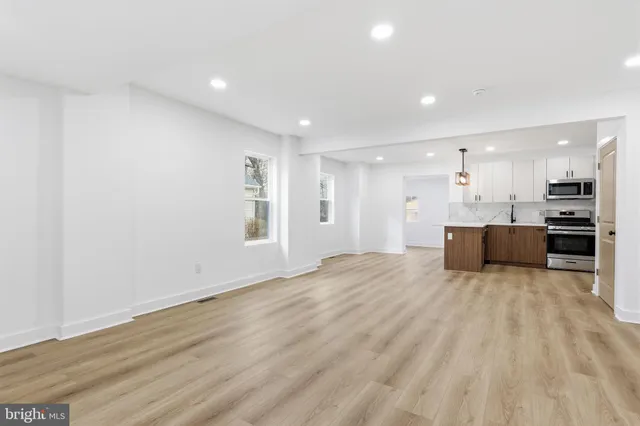 a view of kitchen with wooden floor