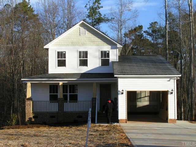 2716 Rustic Brick Road Raleigh, NC 27603 - Photo 1 of 1 a front view of a house with a yard