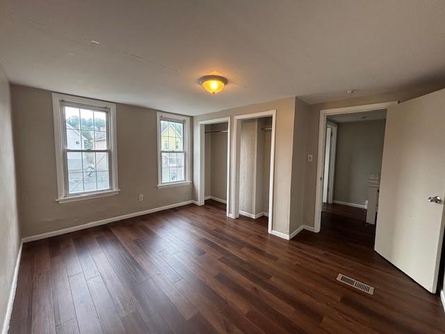 634 Sixth Street Pitcairn, PA 15140 - Photo 9 of 12 an empty room with wooden floor and windows
