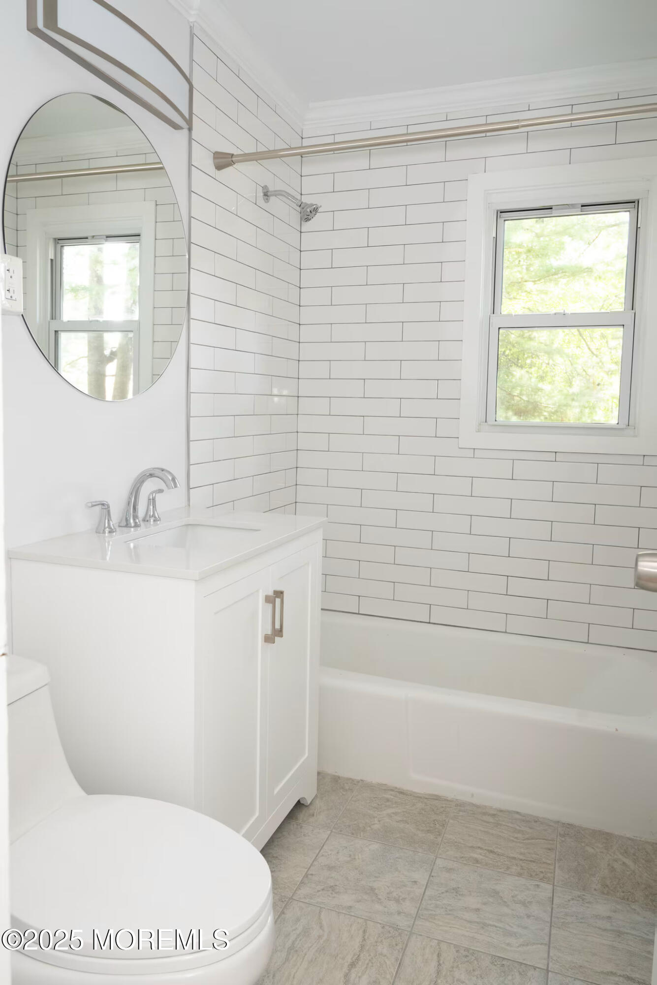 a bathroom with a sink a toilet and bathtub