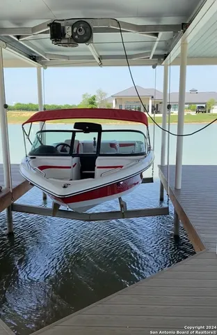 a kitchen with stainless steel appliances a refrigerator and a stove top oven