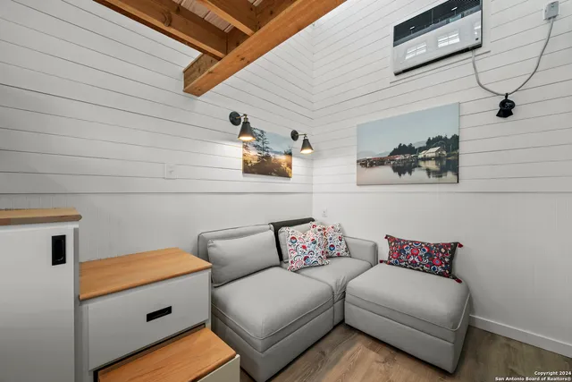 a bedroom with a bed and a table