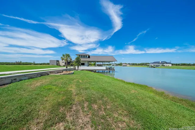 a view of a swimming pool and an outdoor seating