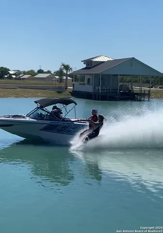 a view of a lake with a car parked in front of it
