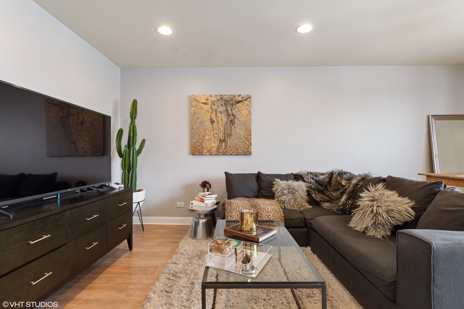 1600 North Halsted Street, Unit 2J Chicago, IL 60614 - Photo 8 of 11 a living room with furniture and a flat screen tv