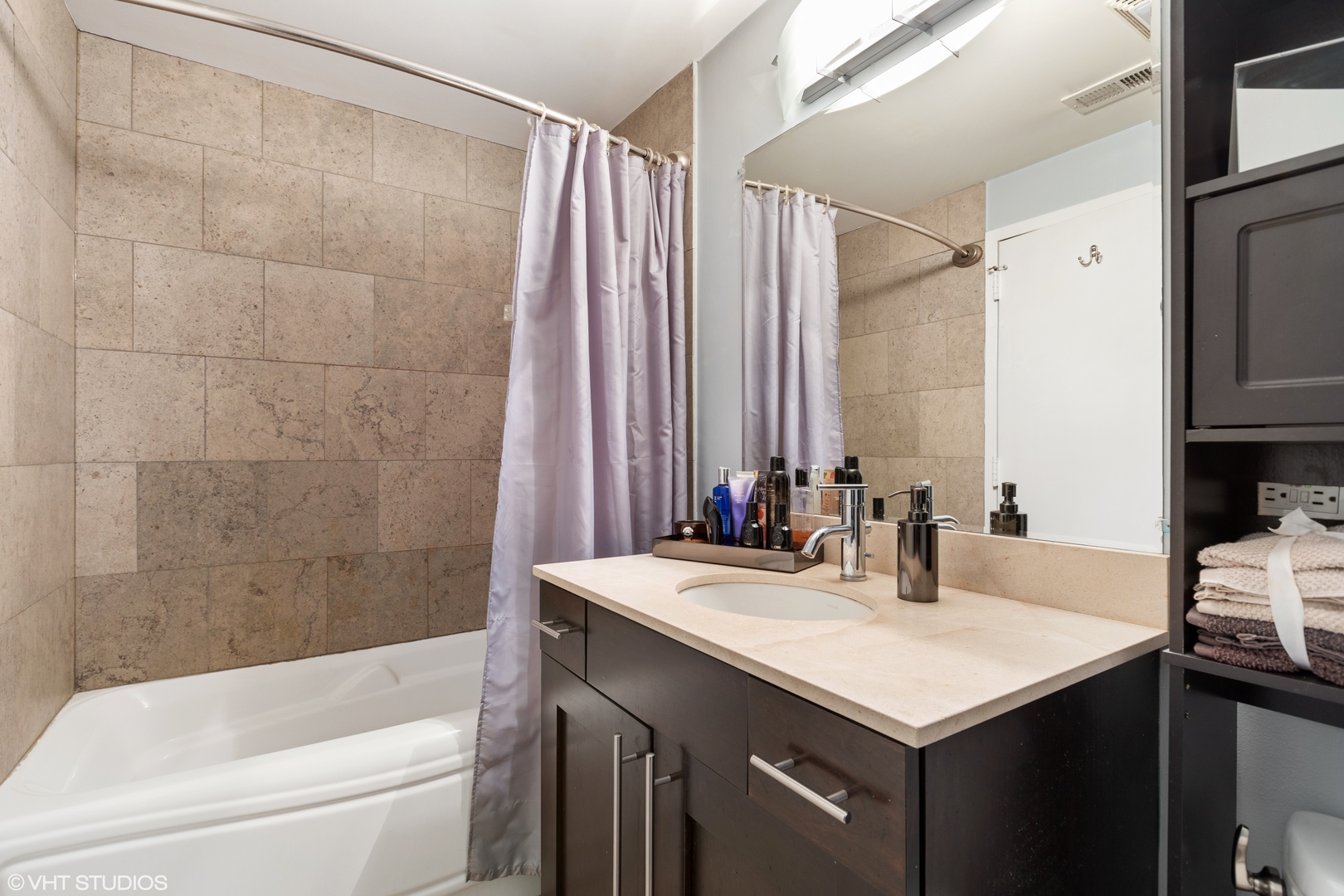 1600 North Halsted Street, Unit 2J Chicago, IL 60614 - Photo 9 of 11 a bathroom with a sink and a mirror