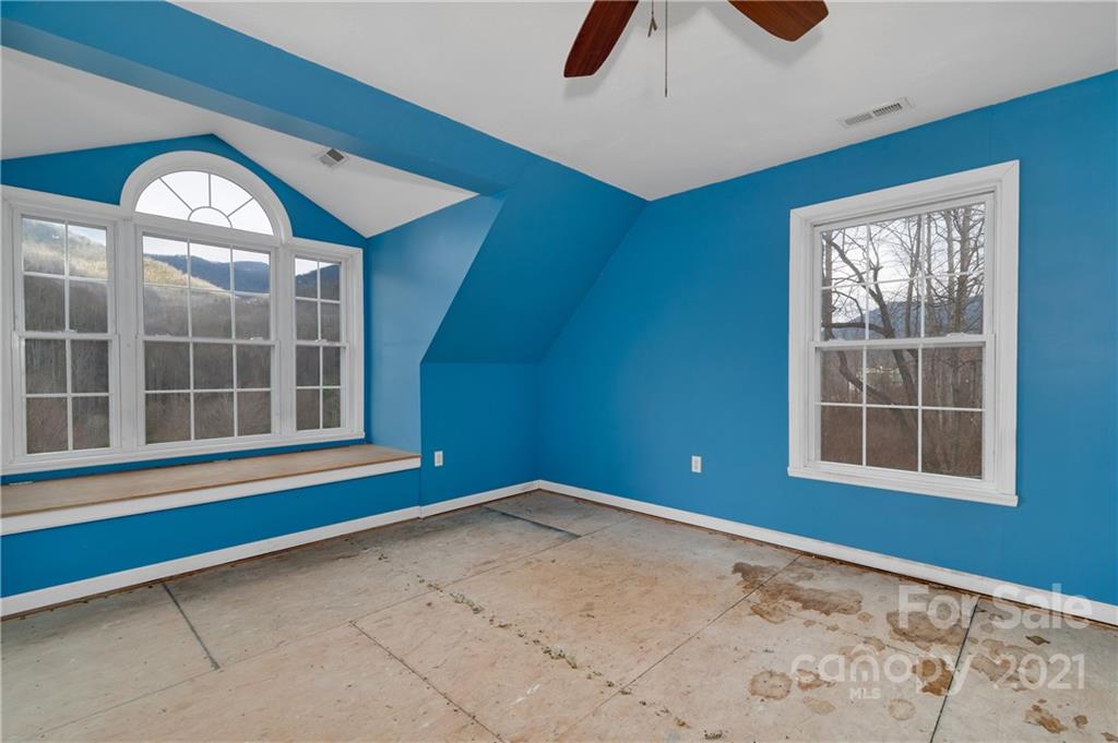 6144 Soco Road Maggie Valley, NC 28751 - Photo 17 of 23 an empty room with windows