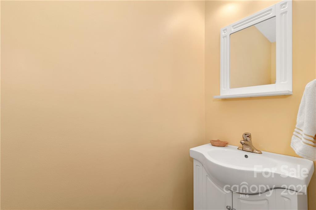 6144 Soco Road Maggie Valley, NC 28751 - Photo 8 of 23 a bathroom with a sink and a mirror