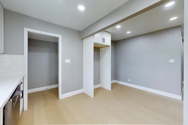 an empty room with a hallway