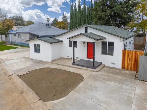 a front view of a house with yard