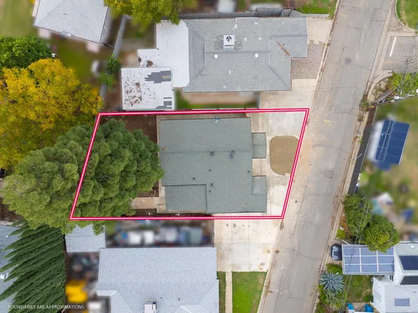 an aerial view of lake and residential houses with outdoor space