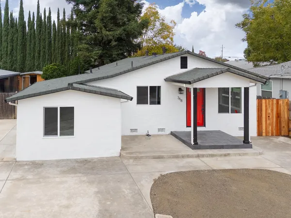 an aerial view of a house with a swimming pool