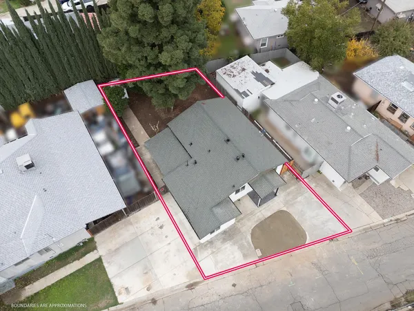 a view of a house with a tree