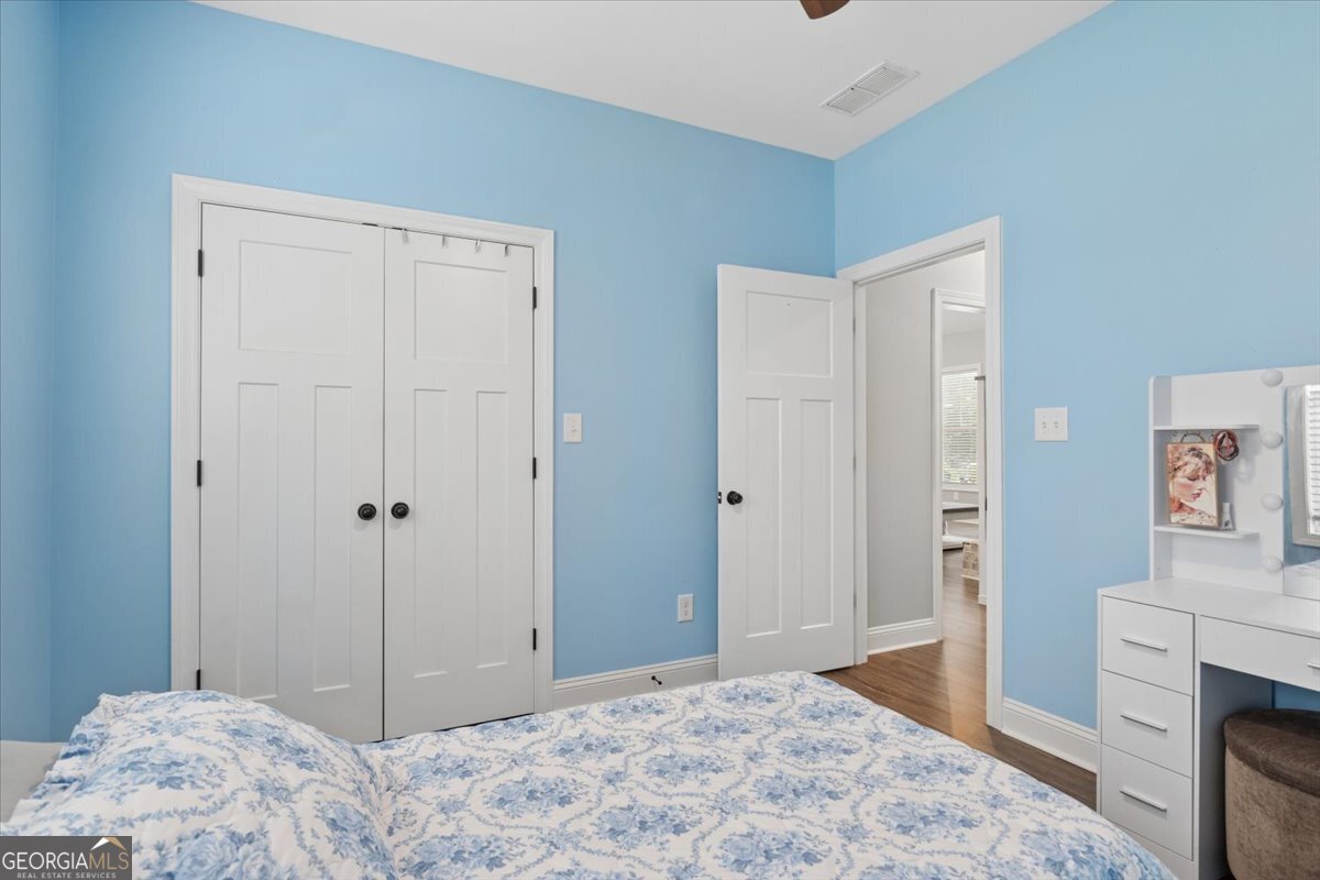 683 Teagle Road Forsyth, GA 31029 - Photo 19 of 50 a bedroom with a bed and a dresser