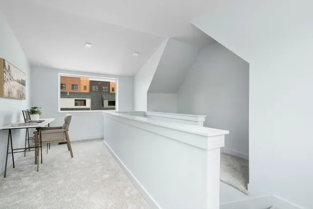 a living room with washer and dryer