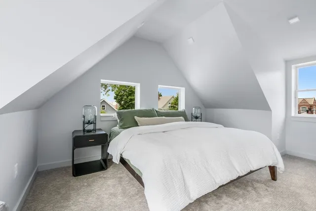 a bedroom with a bed and window