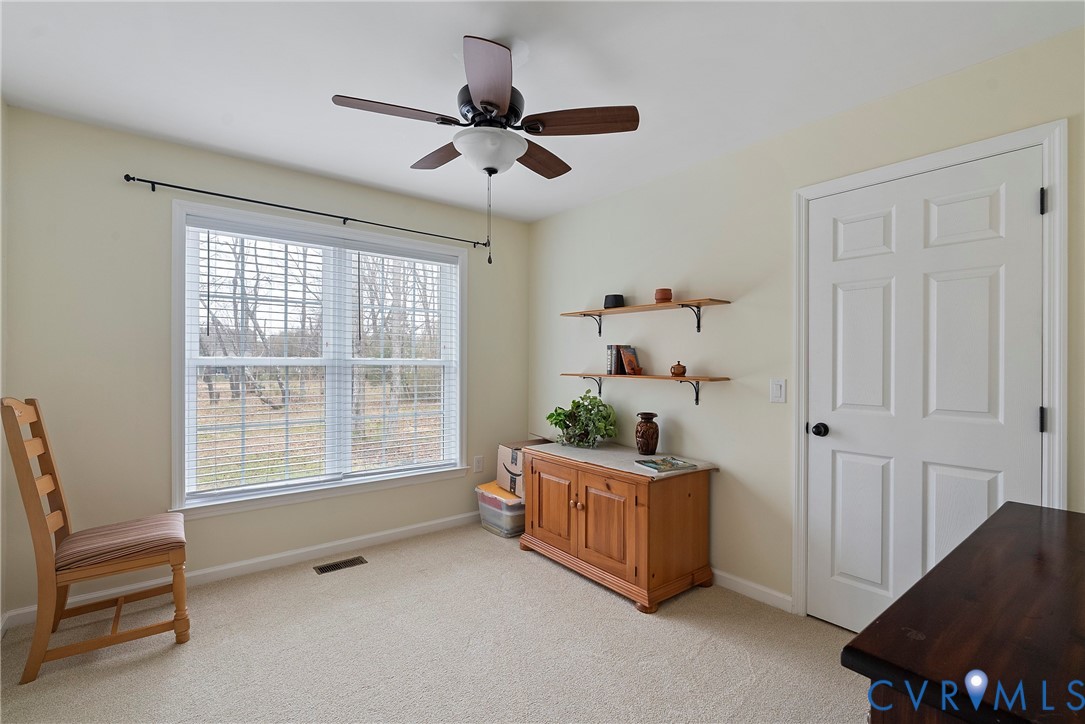 6115 Prospect Road Gloucester, VA 23061 - Photo 18 of 49 a living room with furniture and a window