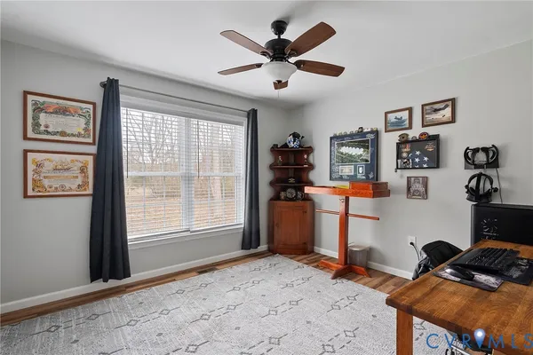 a bedroom with furniture and a window