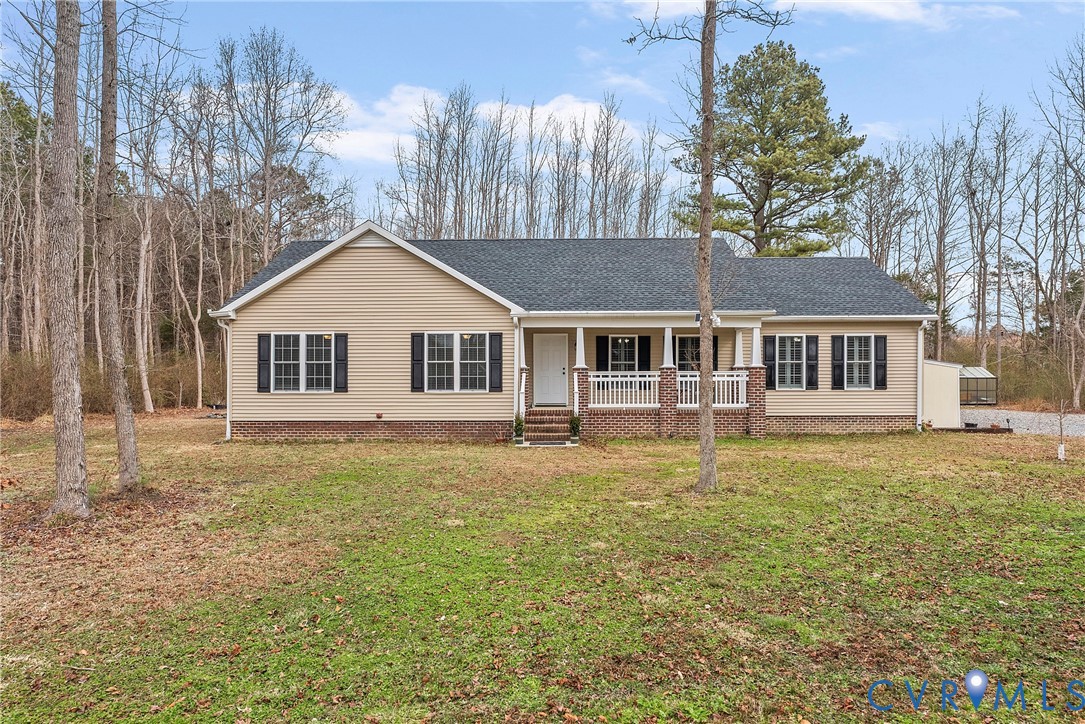 6115 Prospect Road Gloucester, VA 23061 - Photo 2 of 49 a front view of a house with a garden