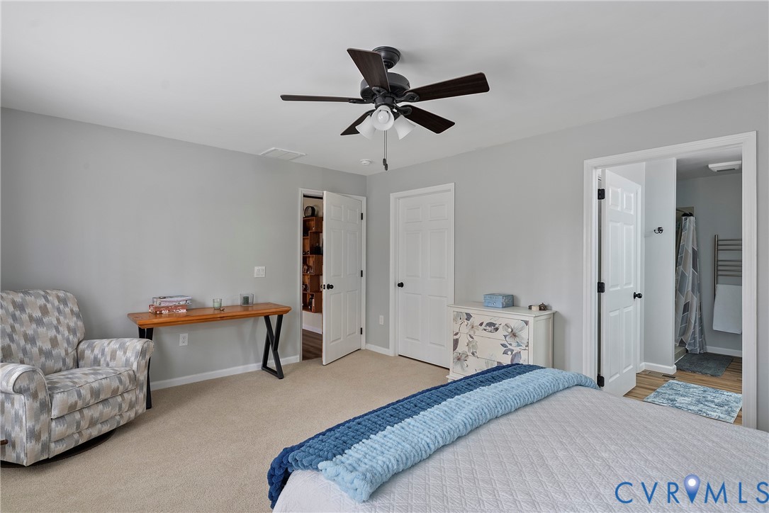 6115 Prospect Road Gloucester, VA 23061 - Photo 27 of 49 a bedroom with a bed and furniture